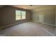 Well-lit bedroom featuring a large window and closet door, providing a canvas for customization at 148 Asa Moseley Rd, Mcdonough, GA 30252