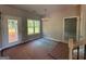 Bright dining area features a door to the outside, large window and modern lighting fixture at 148 Asa Moseley Rd, Mcdonough, GA 30252
