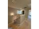 View of the upstairs hallway and stairwell with metal spindles at 148 Asa Moseley Rd, Mcdonough, GA 30252