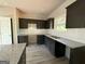 Kitchen featuring dark cabinets, granite countertops, and white tile backsplash at 148 Asa Moseley Rd, Mcdonough, GA 30252