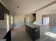 Open-concept kitchen with granite island, dark cabinets, and modern design at 148 Asa Moseley Rd, Mcdonough, GA 30252