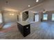 Open floorplan features a granite island, new appliances, and a staircase to the second floor at 148 Asa Moseley Rd, Mcdonough, GA 30252