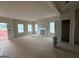Unfinished Living Room featuring large windows, open floor plan and a decorative fireplace at 148 Asa Moseley Rd, Mcdonough, GA 30252