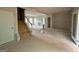 Unfinished Living Room featuring large windows, open floor plan and a fireplace at 148 Asa Moseley Rd, Mcdonough, GA 30252
