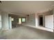 Unfinished Living Room featuring large windows, open floor plan and staircase access at 148 Asa Moseley Rd, Mcdonough, GA 30252