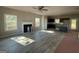 Open-concept living room with modern flooring, a fireplace, and lots of natural light at 148 Asa Moseley Rd, Mcdonough, GA 30252