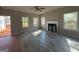 Bright living room featuring modern flooring, fireplace, and multiple windows at 148 Asa Moseley Rd, Mcdonough, GA 30252