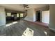 Spacious living area open to the kitchen with modern flooring and natural light at 148 Asa Moseley Rd, Mcdonough, GA 30252