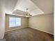 Spacious bedroom with neutral walls and carpet, featuring a ceiling fan and window blinds at 270 Marriott Dr, South Fulton, GA 30349