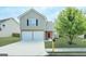 Two-story house with a two-car garage and red door at 270 Marriott Dr, South Fulton, GA 30349