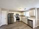 Kitchen with white cabinets, stainless steel appliances, and quartz countertops at 270 Marriott Dr, South Fulton, GA 30349