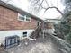 Brick house with wooden stairs leading to a deck and HVAC unit at 211 Hemphill School Rd, Atlanta, GA 30331