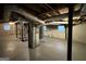 Unfinished basement with high ceilings, ample storage, and separate staircase at 211 Hemphill School Rd, Atlanta, GA 30331