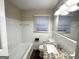 Clean bathroom with white tile and granite countertop at 211 Hemphill School Rd, Atlanta, GA 30331