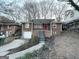 Charming brick home with red door and steps leading to the entrance at 211 Hemphill School Rd, Atlanta, GA 30331