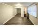 Bedroom with wood-look floors, mirrored closet and door to hallway at 3961 Cornell Sw Blvd, Atlanta, GA 30331