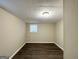 Simple bedroom featuring wood-look floors and neutral walls at 3961 Cornell Sw Blvd, Atlanta, GA 30331