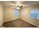 Well-lit bedroom with carpet, ceiling fan and window with blinds at 3961 Cornell Sw Blvd, Atlanta, GA 30331