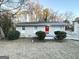 Newly painted home with a red front door and landscaping at 3961 Cornell Sw Blvd, Atlanta, GA 30331