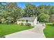 Ranch style home with a large yard and driveway at 3961 Cornell Sw Blvd, Atlanta, GA 30331