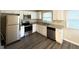 Modern kitchen with stainless steel appliances and granite countertops at 3961 Cornell Sw Blvd, Atlanta, GA 30331