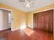 Spacious bedroom with wood floors and access to bathroom at 4296 Ridgetop Trl, Ellenwood, GA 30294