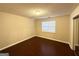 Bright bedroom with wood-look floors and window blinds at 1134 Wagon Trce, Douglasville, GA 30134