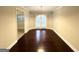 Bright dining room with hardwood floors and French doors leading to the outside at 1134 Wagon Trce, Douglasville, GA 30134