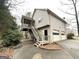 Two-story house with attached two-car garage and screened porch at 1134 Wagon Trce, Douglasville, GA 30134