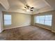 Main bedroom with carpet flooring and large windows at 1134 Wagon Trce, Douglasville, GA 30134