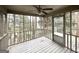 Screened porch with wooden floors and view of the backyard at 1134 Wagon Trce, Douglasville, GA 30134