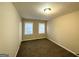 Cozy bedroom with carpet and lots of natural light at 1991 Marvin Sw Ln, Atlanta, GA 30311
