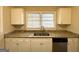 White shaker cabinets and granite countertops in this updated kitchen at 1991 Marvin Sw Ln, Atlanta, GA 30311