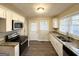 Modern kitchen with granite countertops and stainless steel appliances at 1991 Marvin Sw Ln, Atlanta, GA 30311