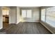 Bright living room with hardwood floors and large windows at 1991 Marvin Sw Ln, Atlanta, GA 30311