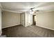 Main bedroom with carpet, ceiling fan, and en-suite bathroom at 6419 Katherine St, Douglasville, GA 30134