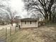 Detached outbuilding with windows and small yard at 6419 Katherine St, Douglasville, GA 30134