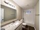 Bathroom with granite vanity and bathtub at 1024 Ada Nw Ave, Atlanta, GA 30318