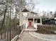 Two-story house with red door and deck at 1024 Ada Nw Ave, Atlanta, GA 30318