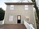 Tan house exterior with deck and black door at 1024 Ada Nw Ave, Atlanta, GA 30318
