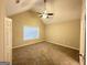 Main bedroom with vaulted ceiling and window at 1024 Ada Nw Ave, Atlanta, GA 30318