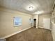 Spacious basement room with carpet, window, closet, and built-in shelving at 2048 Glendale Dr, Decatur, GA 30032