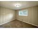 Bedroom with wood paneled walls and plush carpeting at 2048 Glendale Dr, Decatur, GA 30032