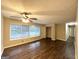 Spacious living room with dark laminate floors and large windows at 2048 Glendale Dr, Decatur, GA 30032