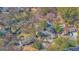 Aerial view of property featuring mature trees, in-ground pool, and detached garage at 505 River Valley Rd, Sandy Springs, GA 30328