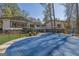 Backyard with a covered pool and outdoor seating area perfect for entertaining at 505 River Valley Rd, Sandy Springs, GA 30328