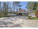 Stunning home featuring a spacious driveway and attached two-car garage at 505 River Valley Rd, Sandy Springs, GA 30328