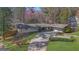 Charming ranch-style home with well-maintained landscaping and circular driveway at 505 River Valley Rd, Sandy Springs, GA 30328