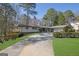 Attractive single Gathering home featuring a large front yard with mature trees at 505 River Valley Rd, Sandy Springs, GA 30328