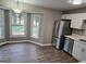 Bright dining area with bay window and wood-look flooring at 471 Glen Terrace Rd, Auburn, GA 30011